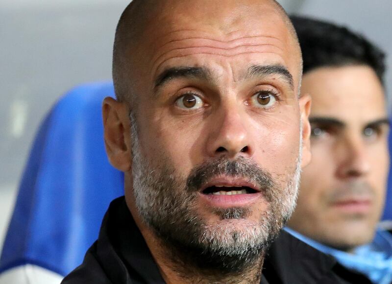 epa07064558 Manchester City's head coach Pep Guardiola reacts during Champions League Group F first round soccer match between TSG 1899 Hoffenheim and Manchester City in Sinsheim, Germany, 02 October 2018.  EPA/ARMANDO BABANI