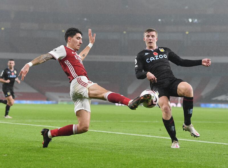 LONDON, ENGLAND - NOVEMBER 08: Hector Bellerin of Arsenal takes on Matt Targett of Aston Villa during the Premier League match between Arsenal and Aston Villa at Emirates Stadium on November 08, 2020 in London, England. Sporting stadiums around the UK remain under strict restrictions due to the Coronavirus Pandemic as Government social distancing laws prohibit fans inside venues resulting in games being played behind closed doors. (Photo by Stuart MacFarlane/Arsenal FC via Getty Images)