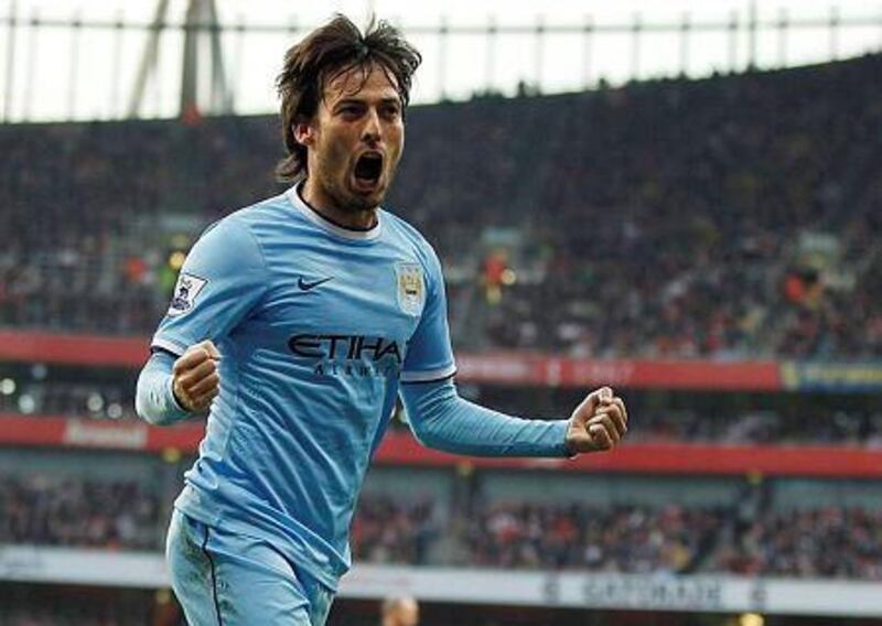 David Silva has signed a new five-year contract with Manchester City and he he has lofty goals on reaching the Uefa Champions League while playing for the English Premier League champions. AFP PHOTO / IAN KINGTON