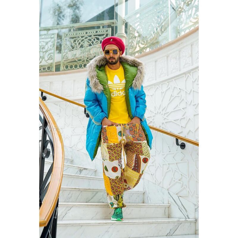 You wouldn't lose the actor in a crowd in this super-bright combo of yellow tee, blue parka and printed pants, from February 12, 2019. Instagram / Ranveer Singh