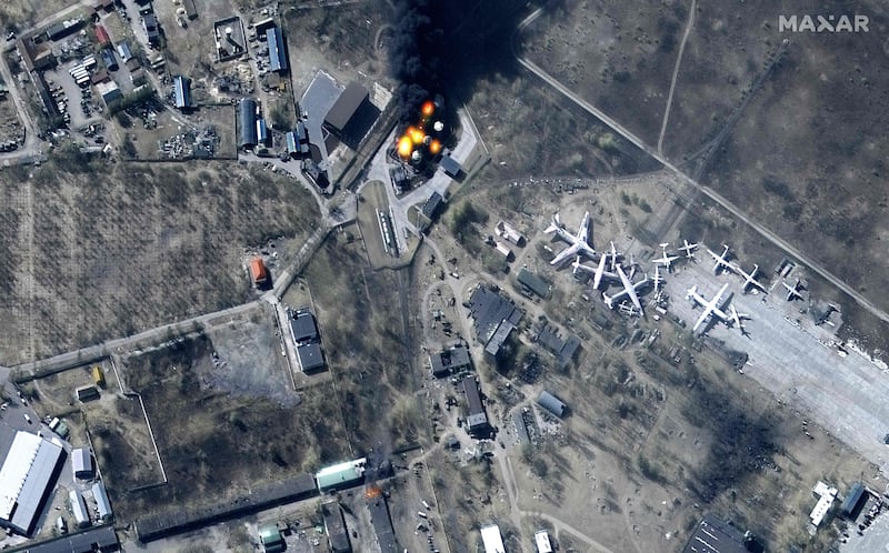 An overview of damaged buildings and burning fuel storage tanks at Antonov Airport in Hostomel, north-west of Kyiv. Maxar Technologies  /  AFP