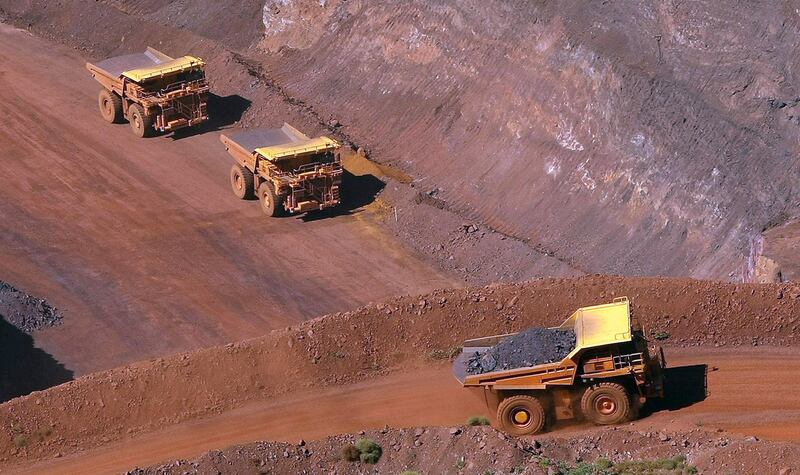 A tipper truck climbs out of a Rio Tinto iron ore mine at Tom Price, about 1,300km north of Perth, Australia. Rio Tinto announced the resignation of its chief executive and two other top officers on Friday over the mining giant's destruction of an Aboriginal site. Tim Wimborne / Reuters