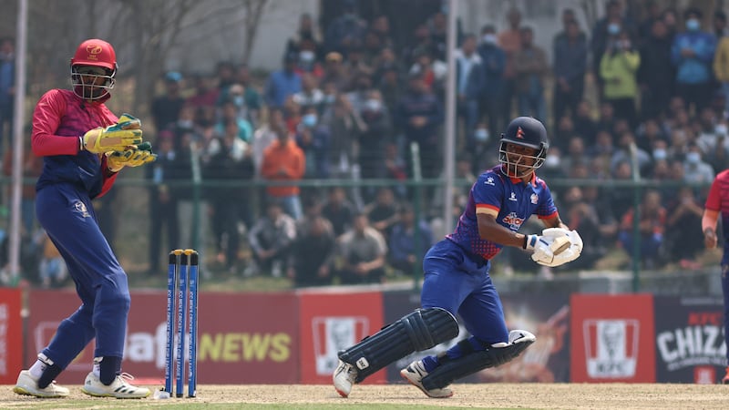 Ashwanth Valthapa keeps wicket as Nepal skipper Rohit Paudel plays a shot.