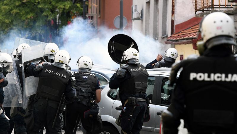 Tear gas is sprayed during clashes in Cetinje. Montenegro's deputy police director, Dragan Gorovic, told state TV that 20 officers were hurt. A state clinic in Cetinje said around 30 civilians sought help for injuries. AFP