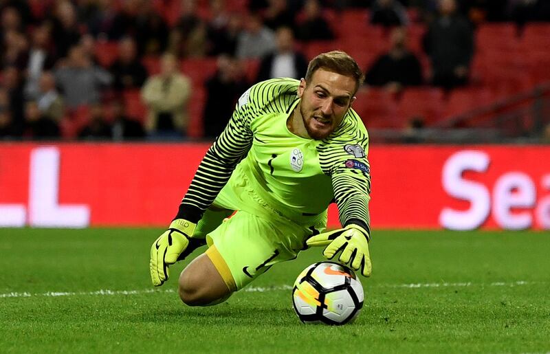 Slovenia goalkeeper Jan Oblak makes a save. Dylan Martinez / Reuters