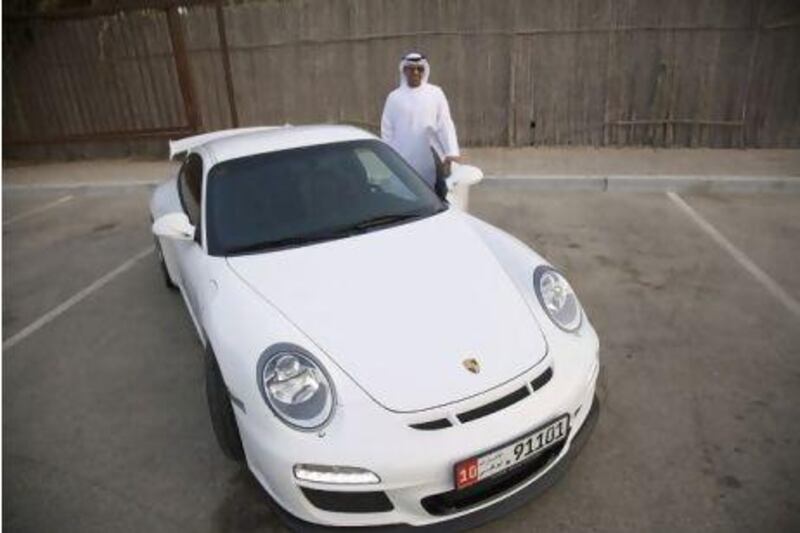 Khaled Al Qubaisi uses his Porsche 911 GT3 on a daily basis as well as on tracks but he intends to keep it in good shape for when his oldest son is ready to drive. Razan Alzayani / The National