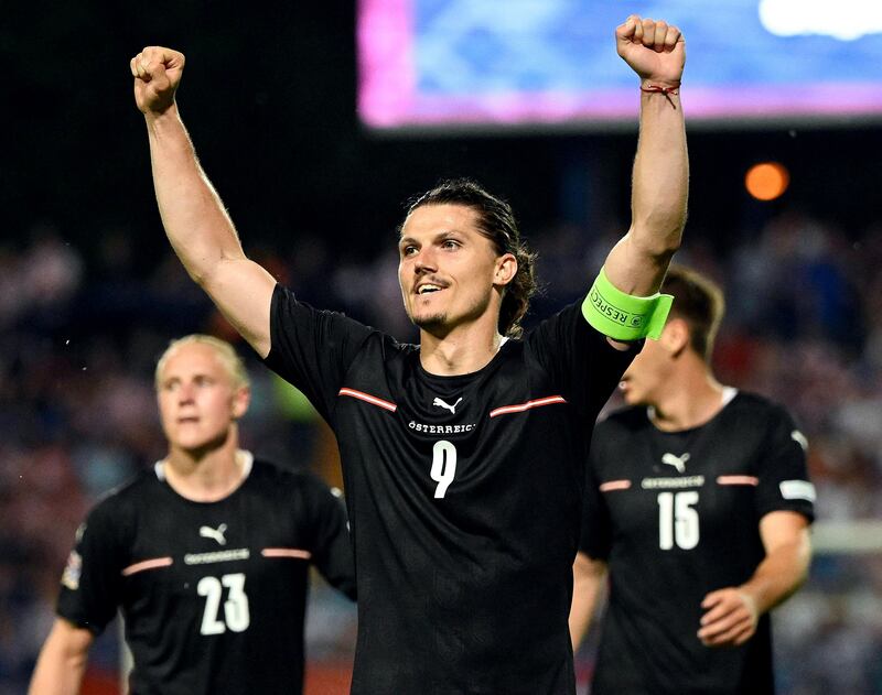 Austria's Marcel Sabitzer (C) celebrates after scoring. AFP