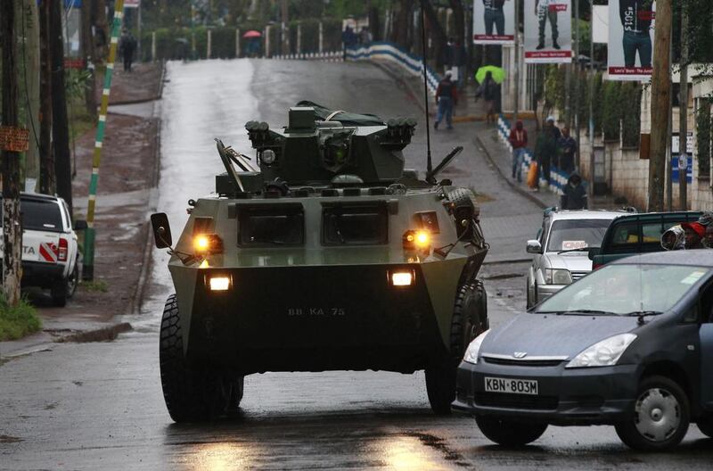 A Kenya Defence Forces (KDF) armoured military vehicle drives to the Westgate shopping centre after an exchange of gunfire inside the mall in Nairobi. Thomas Mukoya / Reuters