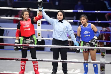 Zineb Bouhmada of UAE (red) beats Diba Rajak of India (blue) in the Under 23 category of the IFMA Muaythai World Championships at ADNEC in Abu Dhabi. Chris Whiteoak / The National