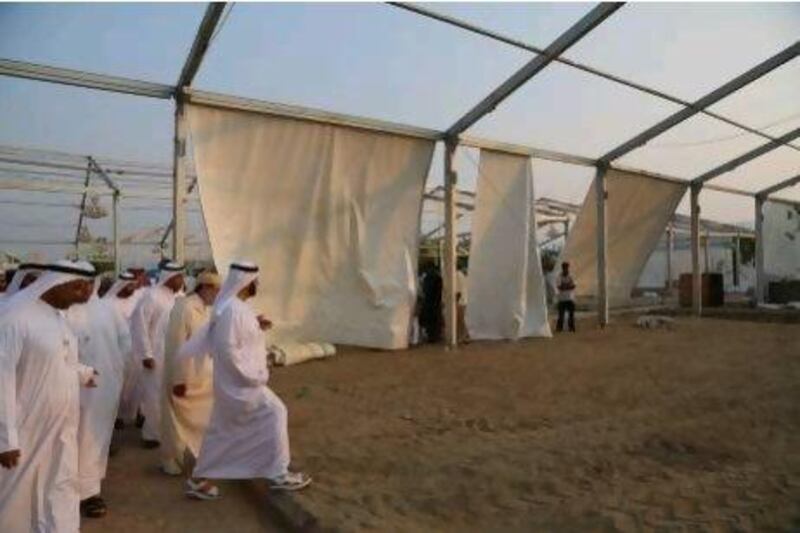 Dr Farouk Hamada, the Crown Prince of Abu Dhabi's religious adviser, and members of the UAE Haj mission inspect the campsite for pilgrims from the Emirates in Mena.