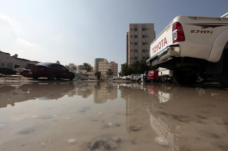 Flooding behind the Ajman Free Zone headquarters caused by heavy rain this week. Forecasters expect more wild weather this weekend.  Jeffrey E Biteng / The National 