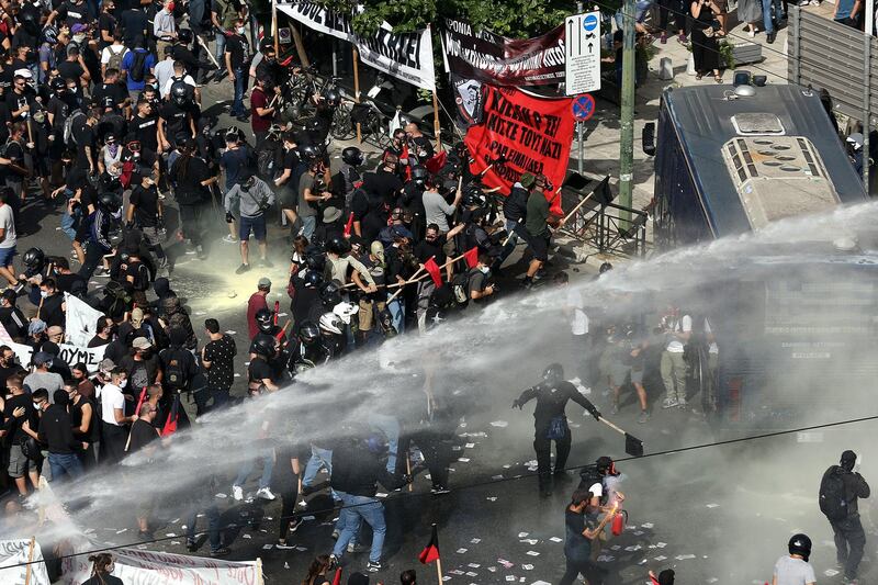 Clashes between riot police and protesters after the announcement of the verdict. EPA