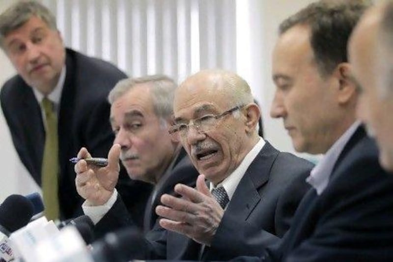 Hassan Abdul Azim, the Syrian opposition delegation leader, centre, speaks at a news conference in Moscow.
