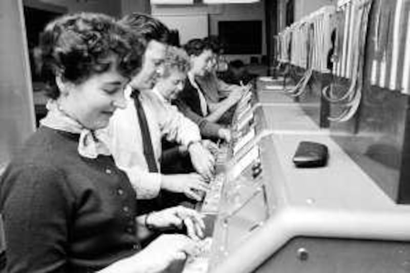 A group of workers operating the tickertape machines at Prestick Airport, near Glasgow. (Malcolm Dunbar / Hulton Archive / Getty Images) *** Local Caption ***  HU7907-001.jpg