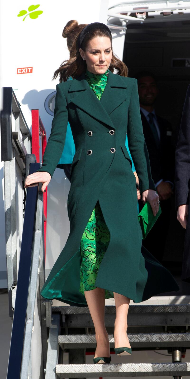 To arrive in Ireland, the duchess wore a  Catherine Walker coat over a dress by Alessandra Rich. Reuters