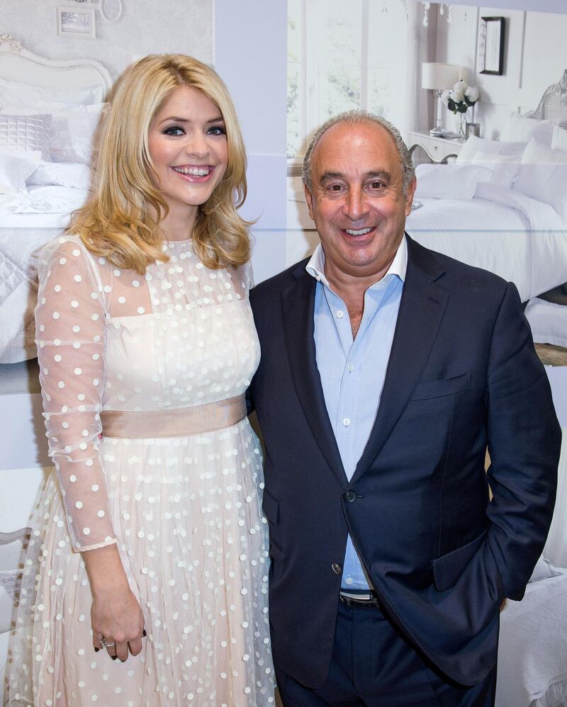 LONDON, ENGLAND - NOVEMBER 21: (EXCLUSIVE COVERAGE) Holly Willoughby (L) poses with Sir Philip Green as she launches her bedding collection at BHS Oxford Street on November 21, 2013 in London, England. (Photo by Samir Hussein/Getty Images for Holly Willoughby For the Home at BHS)