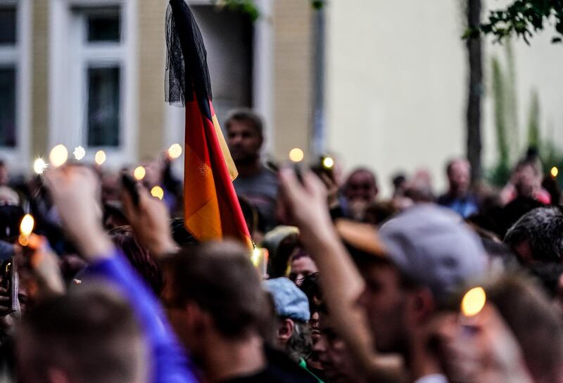 epa07008550 Right wing protesters gather in Koethen, Germany, 09 September 2018. On the night of 08 September to 09 September 2018, a 22-year-old man has died in Koethen. Police states, in this context, two Afghan men were provisionally arrested for the initial suspicion of killing a the man. The occasion and concrete circumstances of the event are not yet known, police said. Several left-wing and right-wing groups called for demonstrations in Koethen in the evening of 09 September 2018.  EPA/ALEXANDER BECHER