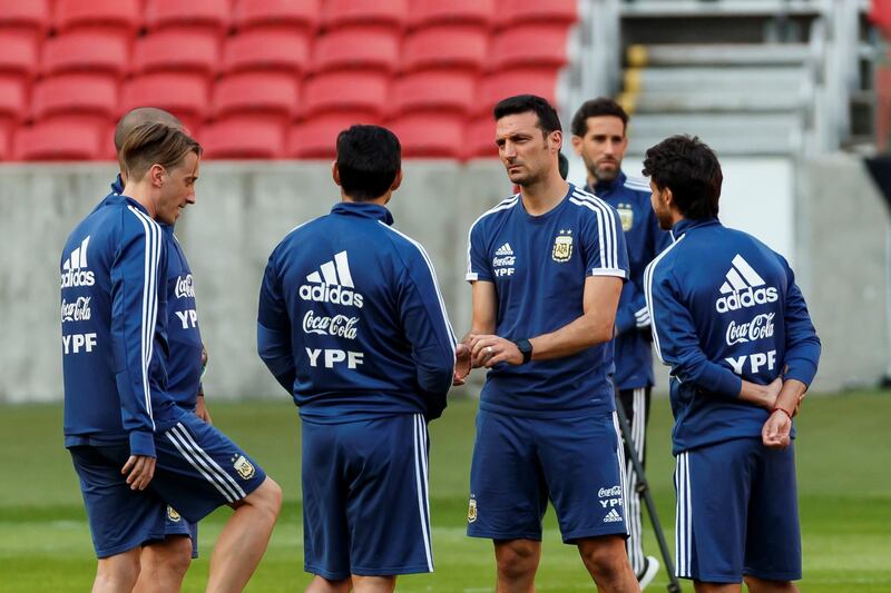 Argentina manager Lionel Scaloni talks to players during the training session. EPA