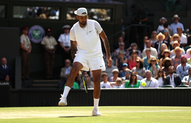 Nick Kyrgios returns a tweener during the first set. Getty