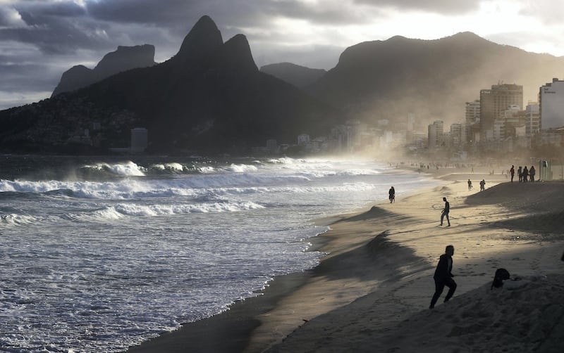RIO DE JANEIRO, BRAZIL - JUNE 02: People walk at the edge of the Atlantic Ocean on Ipanema beach on June 2, 2017 in Rio de Janeiro, Brazil. According to the Urban Climate Change Research Network (UCCRN), Rio's average temperature would rise around one degree Celsius between 2015 and 2020 along with a sea level rise of 14 cm. Changes in Rio's climate are projected to be the most dire of all cities in South America, according to UCCRN. U.S. President Donald Trump announced June 1 that he will withdraw the United States from the Paris Agreement on climate change. BrazilÃ•s Ministry of Foreign Affairs and Ministry of Environment stated Ã”Brazil is seriously concerned with the negative impact of such decision on the multilateral dialogue and cooperation to respond to global changes.Ã•  (Photo by Mario Tama/Getty Images)