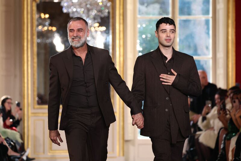 Georges Hobeika, left, and his son and co-designer, Jad, take a bow. AFP 