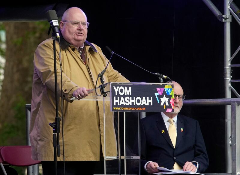 Eric Pickles, the UK special envoy for post-Holocaust issues, addresses those gathered for the Yom Hashoah event in central London. PA / AP