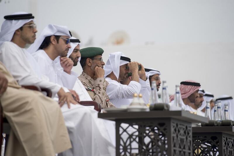 Sheikh Mohammed bin Zayed, Crown Prince of Abu Dhabi and Deputy Supreme Commander of the Armed Forces, watches the Union Fortress military exercise at the Corniche in the capital yesterday. Sheikh Mansour bin Zayed, Deputy Prime Minister and Minister of Presidential Affairs, Sheikh Hazza bin Zayed, National Security Adviser and Vice Chairman of the Abu Dhabi Executive Council, Sheikh Mohammed bin Saud Al Qasimi, Crown Prince and Deputy Ruler of Ras Al Khaimah, and Lt Gen Hamad Al Romaithi, Chief of Staff of the Armed Forces, were among the other dignitaries who attended the event. Rashed Al Mansoori / Crown Prince Court – Abu Dhabi