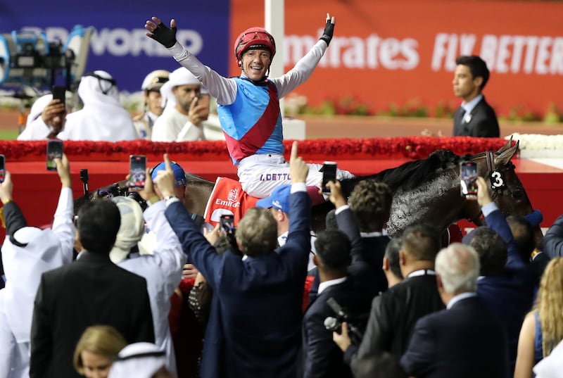 Frankie Dettori  celebrates after guiding Country Grammer to victory in the Dubai World Cup at Meydan racecourse on Saturday, March 26, 2022. Chris Whiteoak / The National