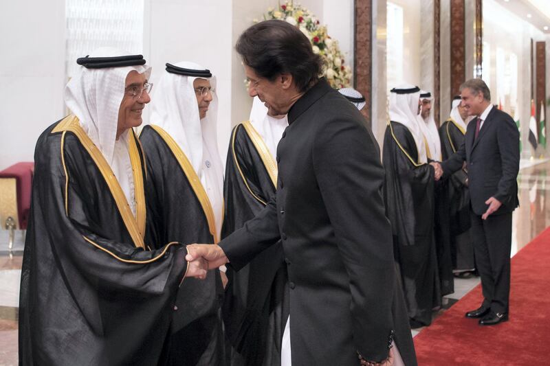 ABU DHABI, UNITED ARAB EMIRATES - September 19, 2018: HE Zaki Anwar Nusseibeh (L), receives HE Imran Khan, Prime Minister of Pakistan (R), during a reception at the Presidential Airport. 

( Saeed Al Neyadi / Crown Prince Court - Abu Dhabi )
---