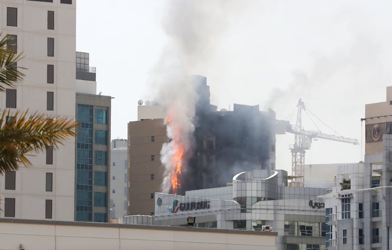 A crane was used to assist firefighters in extinguishing the flames.