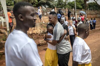 YAOUNDE, CAMEROON - MARCH 18: FIFA Legend Samuel Eto‚Äôo hugs a child during his visit in school, event organized by FIFA Foundation-supported NGO, Sport and Cooperation Network, on March 18, 2019 in Yaounde, Cameroon. (Photo by Maja Hitij - FIFA/FIFA via Getty Images)