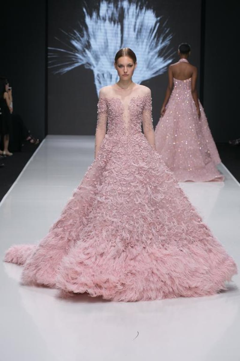 A feathery gown featuring heavy applique. Courtesy Michael Cinco and Couturissimo