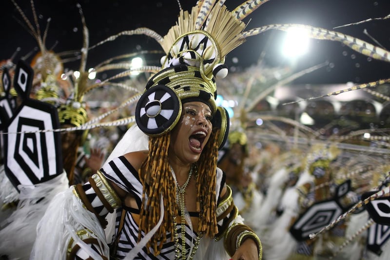 A reveller of Grande Rio samba school performs. Reuters