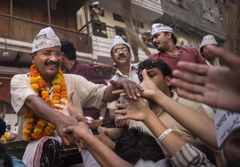 Aam Aadmi Party leader Arvind Kejriwal is greeted by supporters during a rally on May 9, 2014 in Varanasi. Kevin Frayer/Getty Images