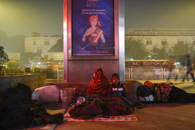 Reena Devi, 30, and her son Roshan Raj, 12, who has arthritis, outside the All India Institute of Medical Sciences.  Photo: Taniya Dutta / The National