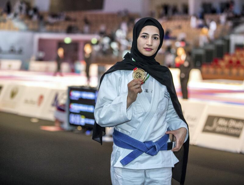 Abu Dhabi, UAE,  April 18, 2018.  
AUH Jui-Jitsu Championships 2018.  Mahra Al Hanaei, blue belt - 57 Kg. juvenile division shows off her gold medal.
Victor Besa / The National
Sports
Reporter: Amith Passela