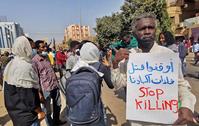 Sudanese protesters take to the streets of the capital Khartoum as they rally against the October 2021 military coup, on January 13, 2022.  The demonstrations which converged from several parts of Khartoum came only days after the United Nations launched a bid to facilitate talks between Sudanese factions.  AFP