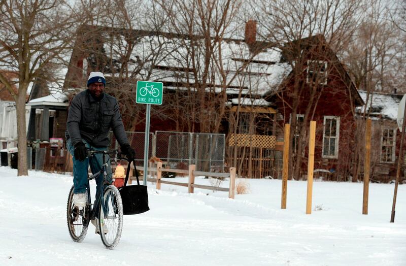 Jerry Jackson rides his bike on a cold day in Detroit, Michigan. AFP