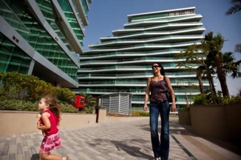 Abu Dhabi resident Mandy Coetzee (cq), walks withher daughter Mikayla, 3, as she check out the new apartment development Al Bandar, near Al Raha Thursday, Feb. 17, 2011, near the Abu Dhabi - Dubai road. The community, already populated by many young professionals, is becoming increasingly popular as many amenities are already present and more restaurants and shops are coming soon. 
(Silvia Rázgová / The National)