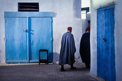 KAIROUAN, TUNISIA - January 22, 2002: two unknown person in the narrow streets with the old house in Medinah, Kairouan, Tunisia. Getty Images