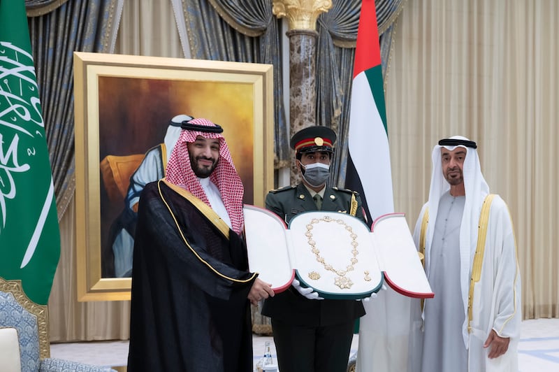 Sheikh Mohamed bin Zayed presents the Order of Zayed medal to Prince Mohammed bin Salman during the official reception at Qasr Al Watan.