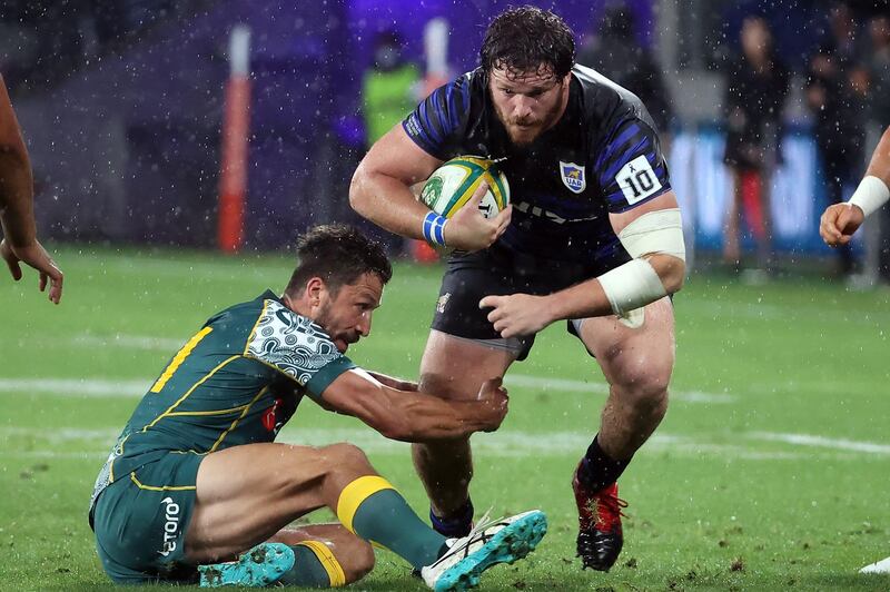 Australia's Jake Gordon tackles Julian Montoya of Argentina. AFP