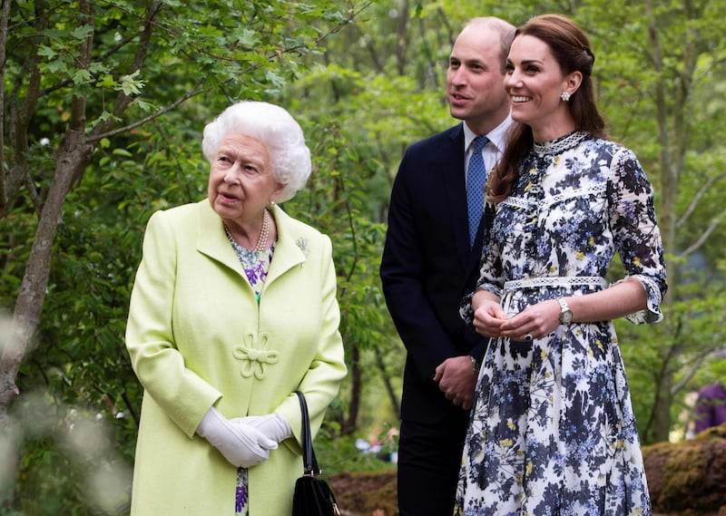 Catherine, Duchess of Cambridge shows Queen Elizabeth II and Prince William, Duke of Cambridge, around the 'Back to Nature Garden' garden, that she designed along with Andree Davies and Adam White, during their visit to the 2019 RHS Chelsea Flower Show in London on May 20, 2019. AFP