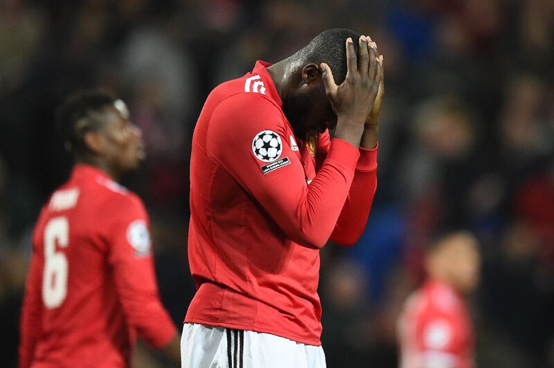 TOPSHOT - Manchester United's Belgian striker Romelu Lukaku reacts after missing a shot during a last 16 second leg UEFA Champions League football match between Manchester United and Sevilla at Old Trafford in Manchester, northwest England on March 13, 2018. / AFP PHOTO / Oli SCARFF