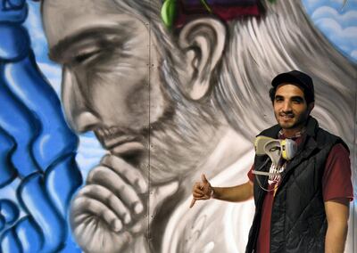  Abdul Malik Al Maskari with his mural at the Muscat Festival. Courtesy Ismael David