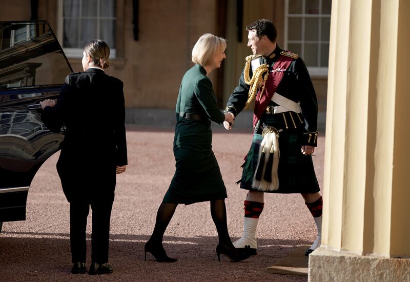 Ms Truss arrives at Buckingham Palace to formally resign. PA