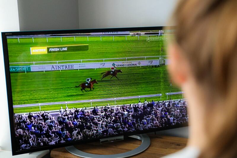The Virtual Grand National on a TV in a Derbyshire household. With the real thing cancelled amid the coronavirus pandemic, the Virtual Grand National turned out to be a hit. PA
