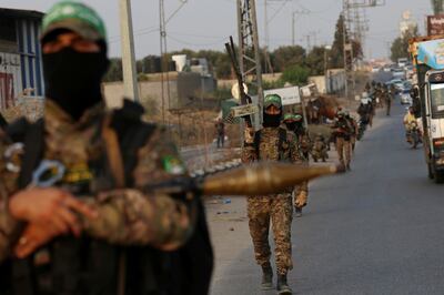 A British MP has called on the government to put the IRGC in the same category as Hamas, whose fighters are pictured here. Britain has designated the Palestinian group as a terrorist organisation. AP