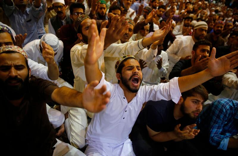 Muslims raise their hands as they pray during special night prayers on Laylat Al Qadr at Jamia Masjid or Grand Mosque in Srinagar, the summer capital of Indian Kashmir, early 12 June 2018. Farooq Khan / EPA