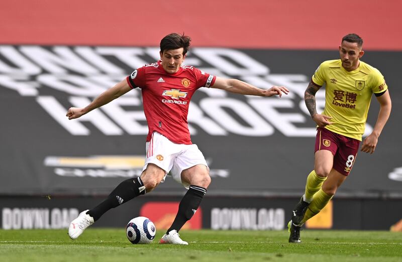 MANCHESTER, ENGLAND - APRIL 18: Harry Maguire of Manchester United in action during the Premier League match between Manchester United and Burnley at Old Trafford on April 18, 2021 in Manchester, England. Sporting stadiums around the UK remain under strict restrictions due to the Coronavirus Pandemic as Government social distancing laws prohibit fans inside venues resulting in games being played behind closed doors. (Photo by Laurence Griffiths/Getty Images)